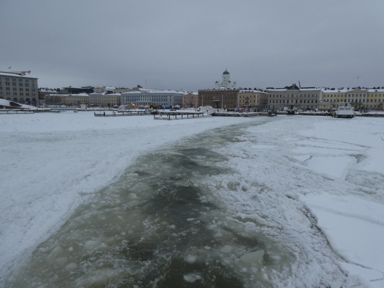 A lane about the width of the ferry, made up of slush, cut into the solid harbour ice and leading back to the jetty in the market square a few hundred metres away.