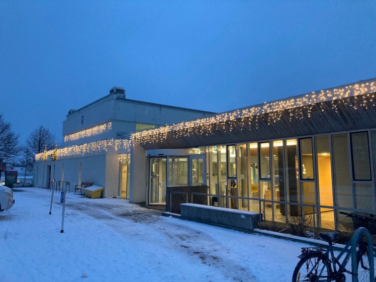 Reykjavik's oldest pool, Sundhollin, housed in a grey-white Art Deco building but with a glass extension which looks out on the other side over the new outdoor pool complex.