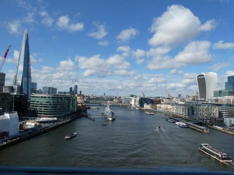 The view west from Tower Bridge, with the Shard off to the left and an assortment of skyscrapers to the right.