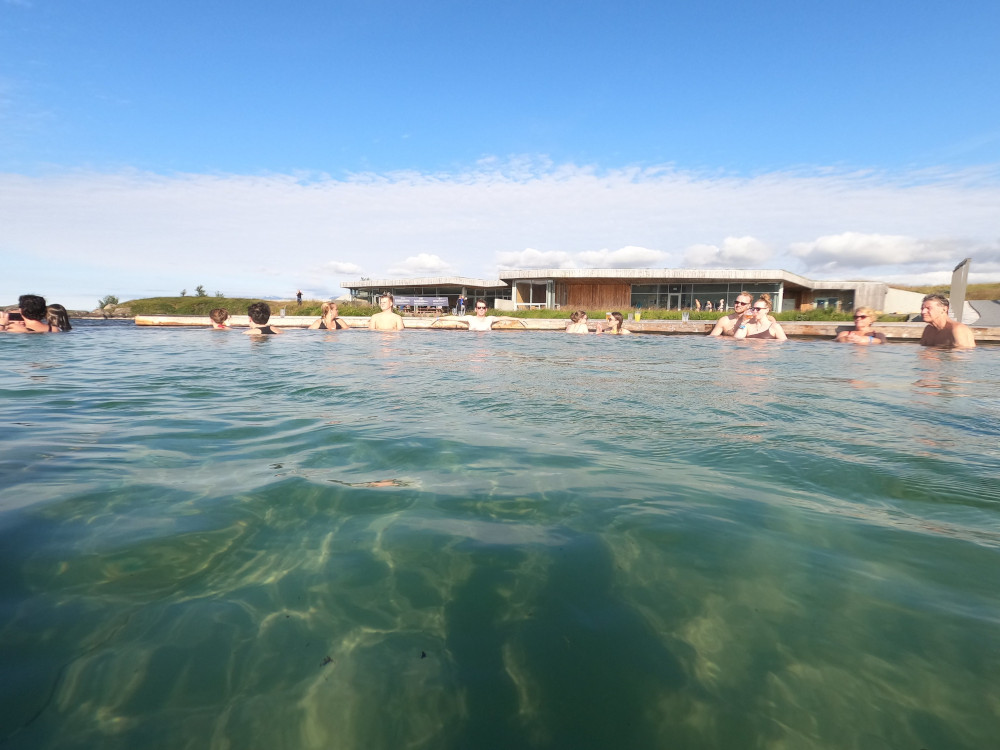 Looking across the pool towards the turf-roofed service building.