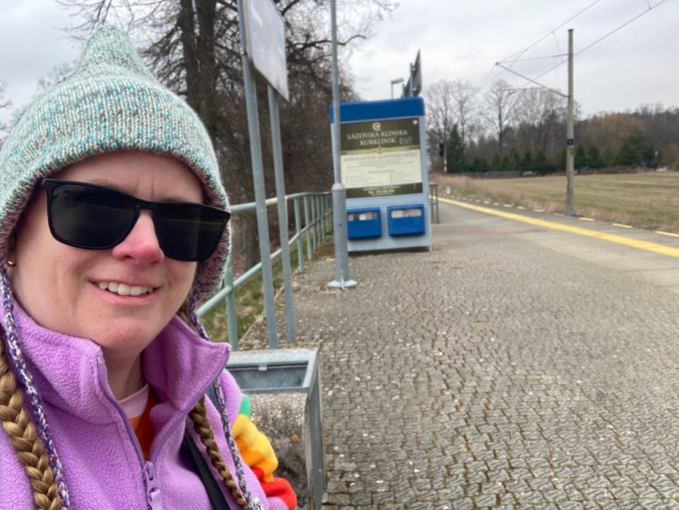 A selfie on the platform at Františkovy Lázně
 Aquaforum station, which is just a single concrete platform with a bench and a shelter on it. The shelter is covered with adverts for spa clinics.
