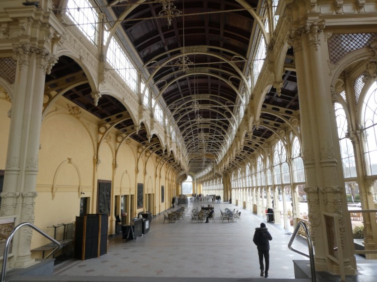 The Colonnades, a decorative iron walkway open on one side and with shops along the other.