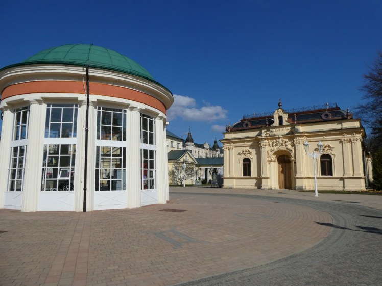 The spa centre of Františkovy Lázně. On the left is a round building and on the right, a square yellow stone one, which both house mineral springs.