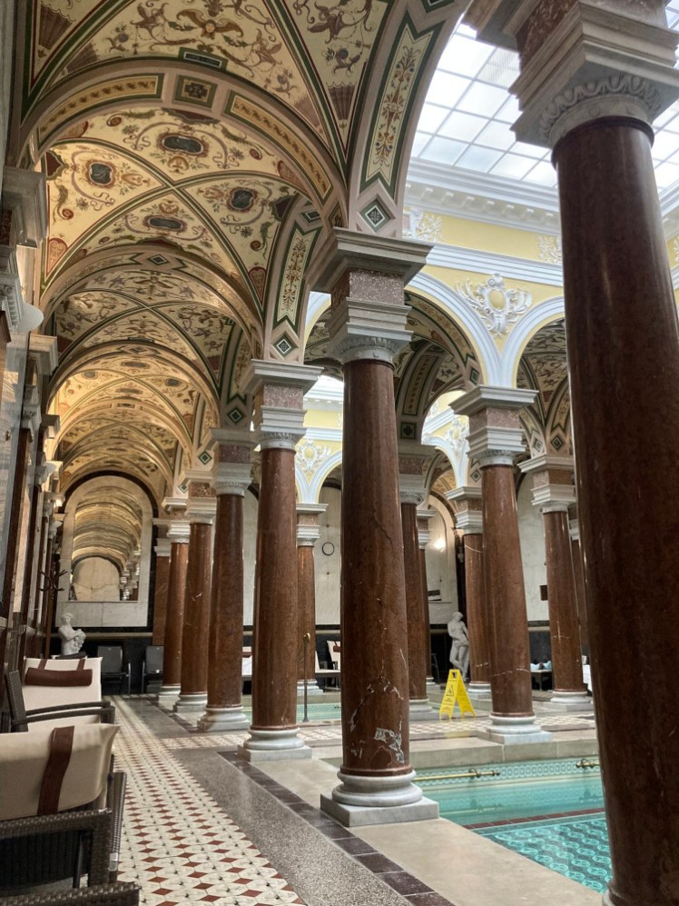 The Roman Baths in the Nové Lázně hotel. The baths are blue and tiled in pretty colours but most of this picture is the brown marble columns and the ornate ceilings. It's not Roman, it's probably more Baroque and it's definitely more interesting than your average modern swimming pool setting.