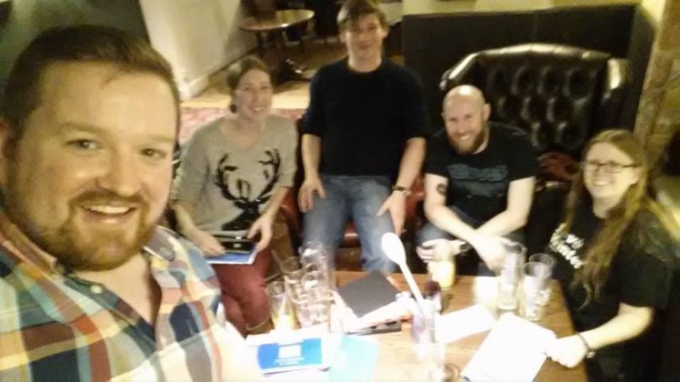 That line probably happened at the pub at Christmas 2016 but I don't have a picture so this is Christmas 2015. We're all simultaneously over-lit, a bit shadowed and not quite in focus.