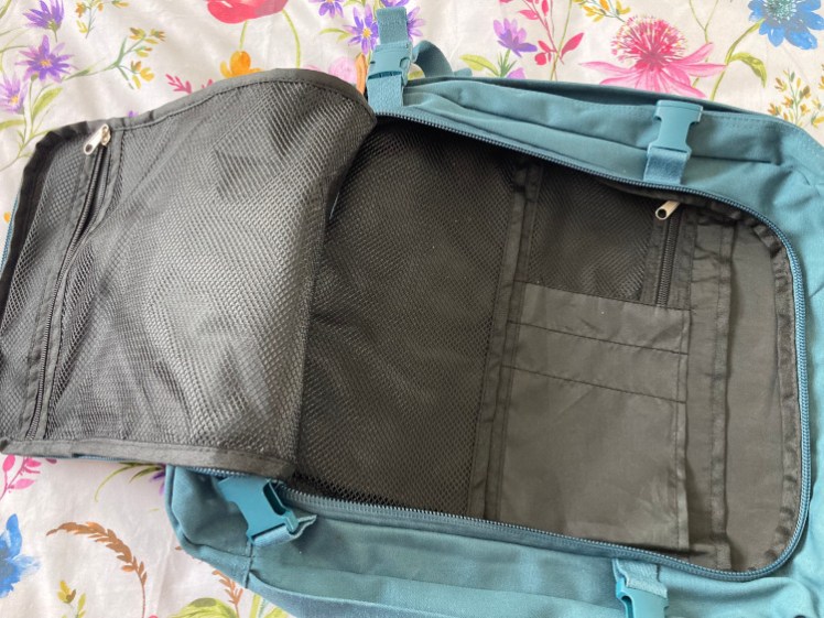 The front pocket opened up fully to show all the different pockets on the inside edge and the large mesh pocket on the outside edge. Because it opens so fully, I'm probably not going to put anything in the open pocket itself.