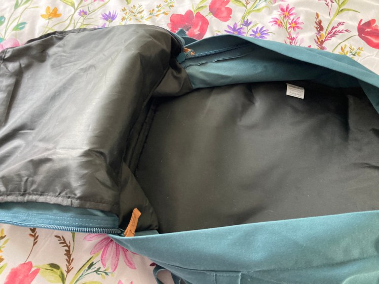 The main compartment. The bag opens around three sides and the front opens along the bottom to reveal a reasonably large space with no dividers or straps.