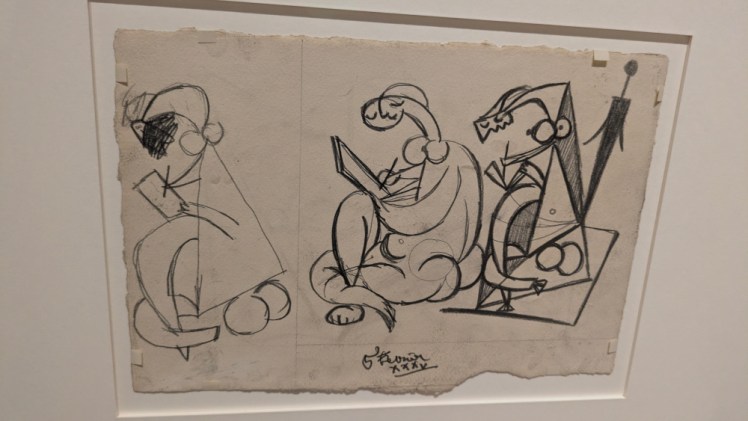 A Picasso sketch of an angular naked woman reading in three increasingly complex sketches.