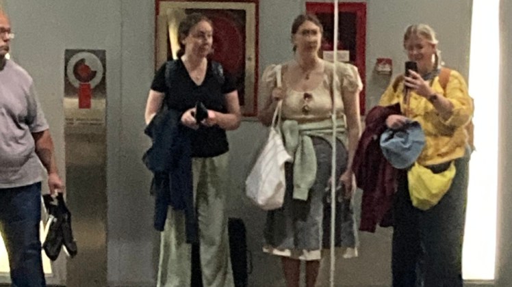 A secret selfie taken in the mirror on the other side of the train platform zoomed right in.