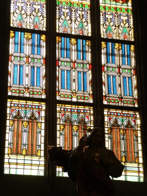 Another geometric window but I think this one is showing something more architectural - some of the patterns look like columns and finials.
