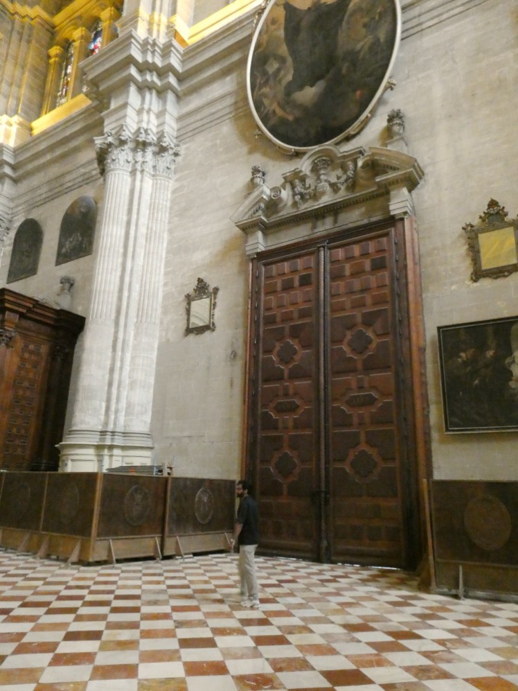The enormous east door (human in front for scale) and the open area behind the quire.