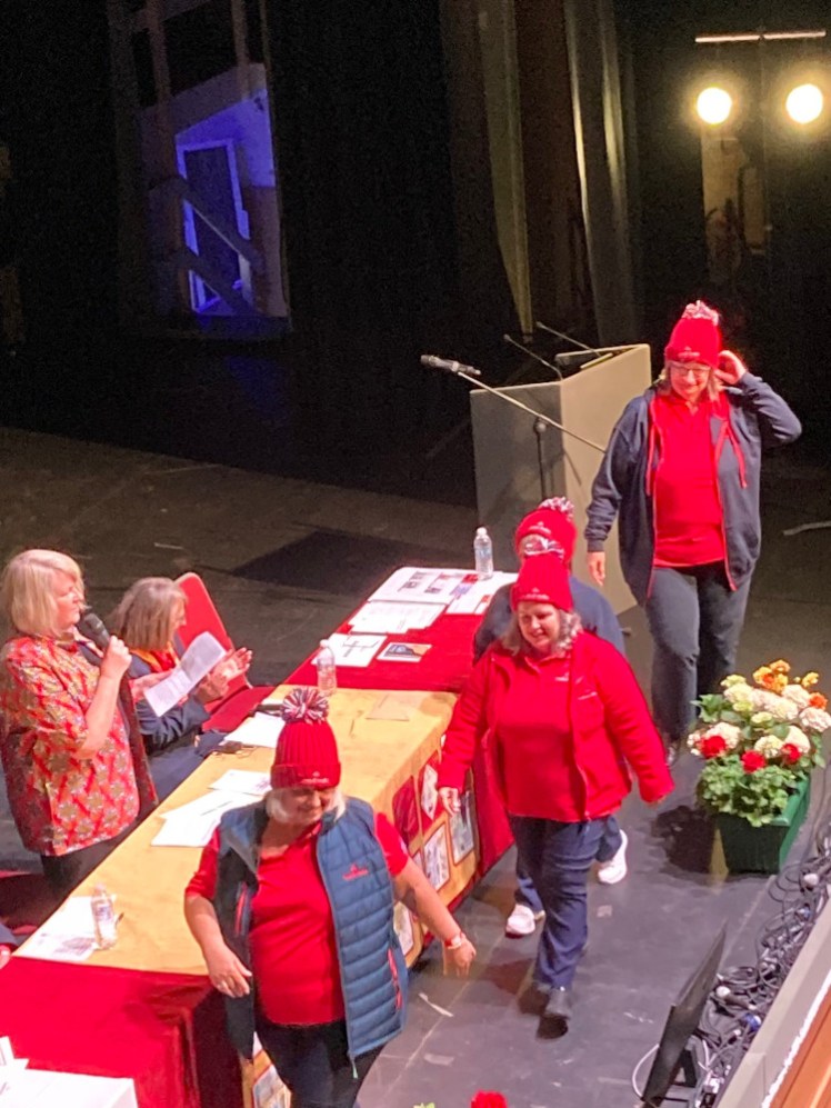 Some of the trustees modelling the new Trefoil wear, mostly in red with navy outerwear.