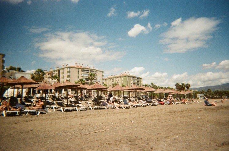 The sunloungers under their thatched umbrellas on the beach. This is also well lit and half-decent in colour!