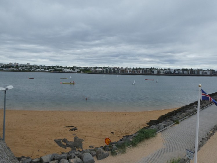 The neighbouring beach and all the small boats out on the fjord that have launched from it.