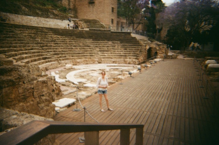 Catherine standing in the amphitheatre. I'm not entirely sure whether she's posing for the camera or not.