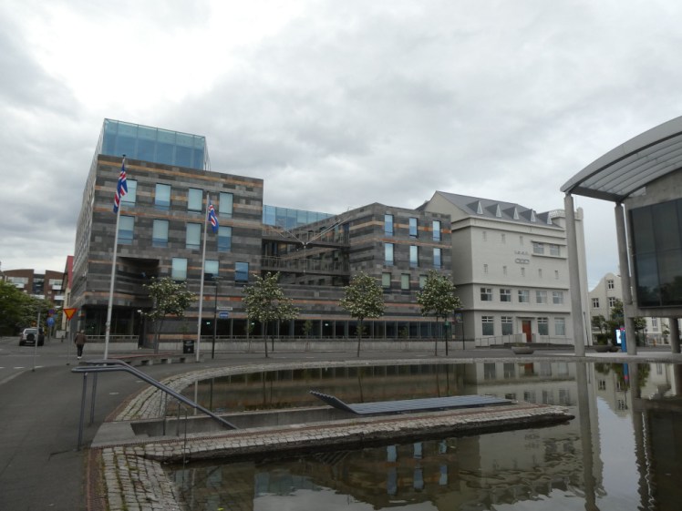 The edge of the Tjornin, Reykjavik's Pond and the City Hall as well as the new Parliament extension at 10pm.