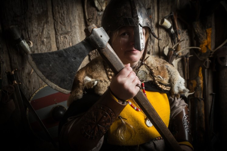 Now I'm wearing a helmet with a piece of iron that comes down over my nose, holding up an axe and looking almost sideways at the camera.