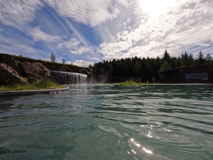 Looking across the lower lagoon towards the waterfall separating the lower from the upper and the line of trees shielding it down the side.