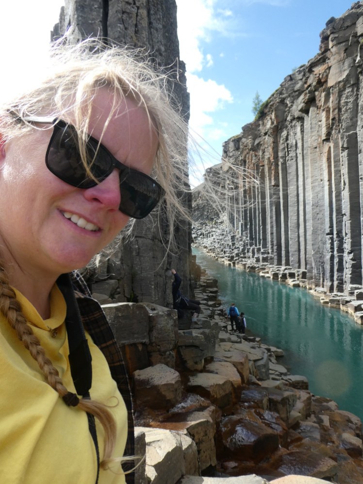 A selfie down in the narrow basalt column part of Studlagil.