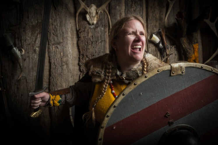 Roaring while holding a heavy wooden shield in one hand and a sword in the other. Actually, I'm making an angry cat noise but it makes a pretty good Viking face.