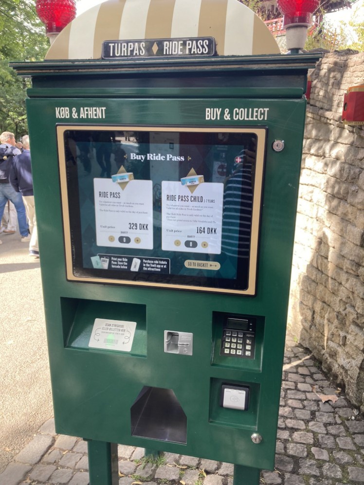 The Ride Pass machine, where you can either scan your ticket or use the touchscreen to buy a pass. It spits out the bracelet at the hole at the bottom.