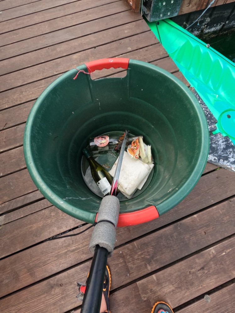 My bucket of rubbish - two glass bottles and a handful of plastic. It's a good thing that there isn't much to fish out of the water, means Copenhagen's looking after its waterways but it makes my collection look a bit pathetic.
